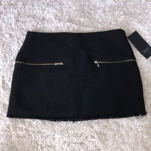 Black suede frayed black mini skirt.